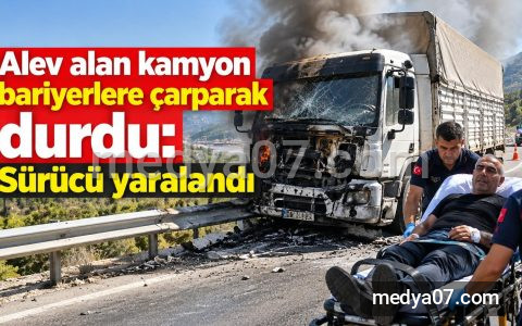 Alev alan kamyon bariyerlere çarparak durdu: Sürücü yaralandı